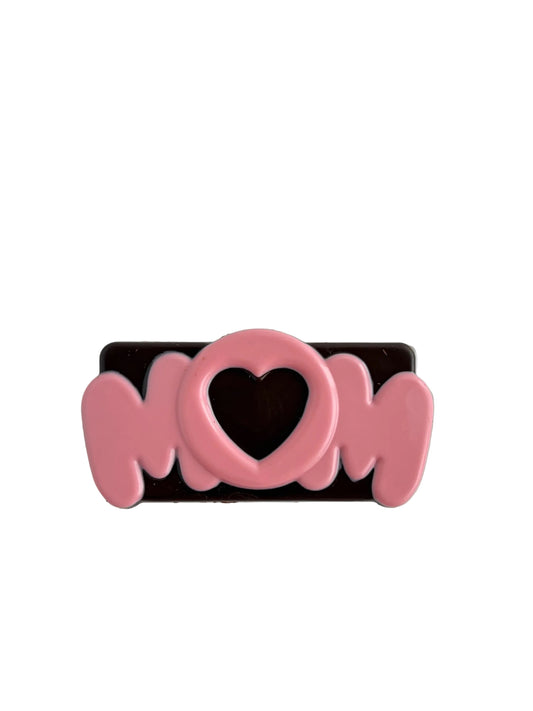 Pink 'Mom' lettering with a heart on a white background